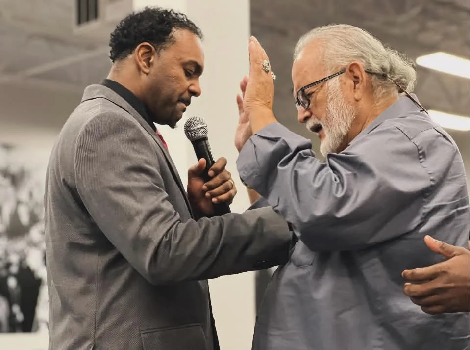 Dennis Dixon praying at an altar ministry gathering