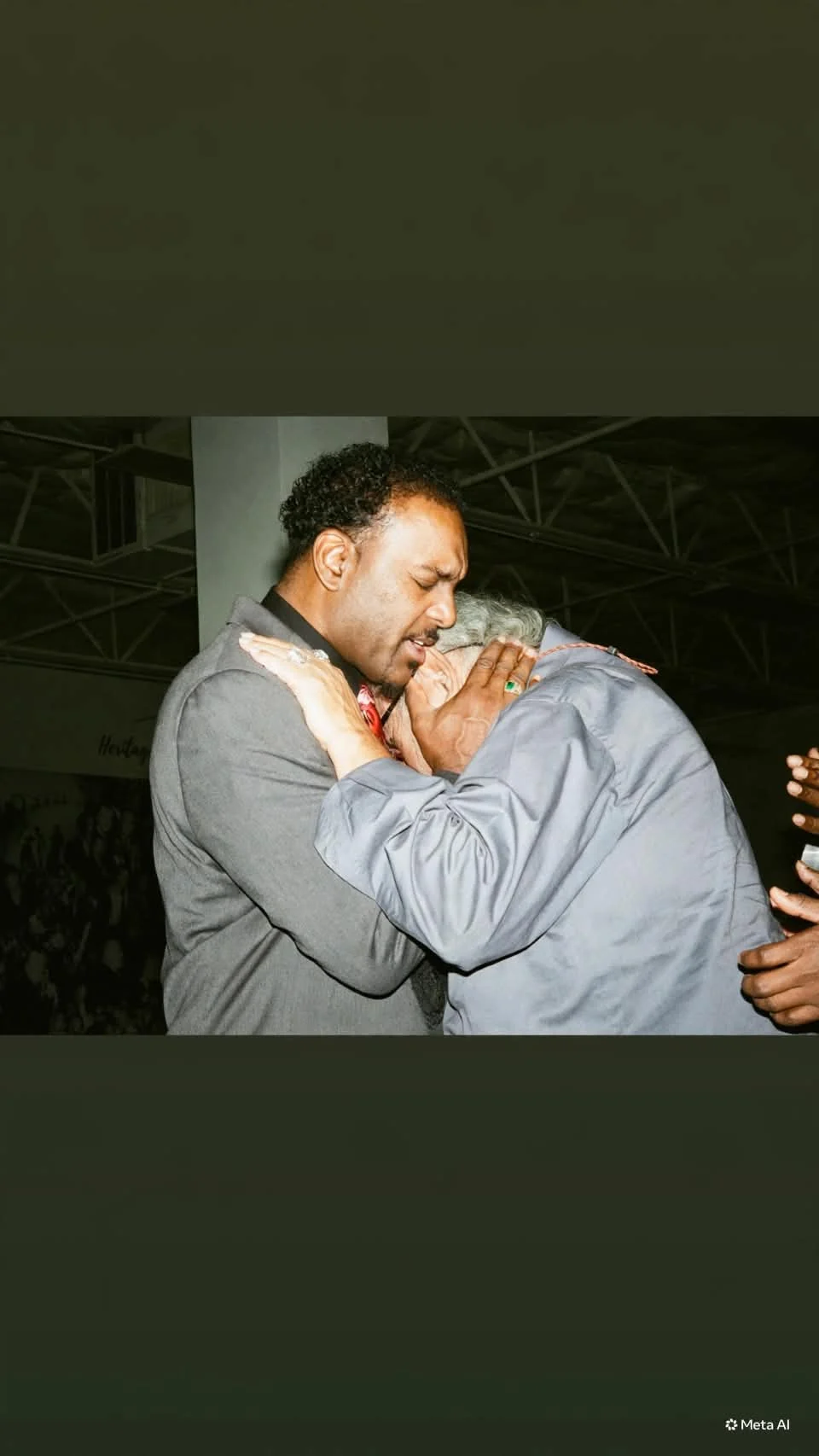Dennis Dixon praying during ministry